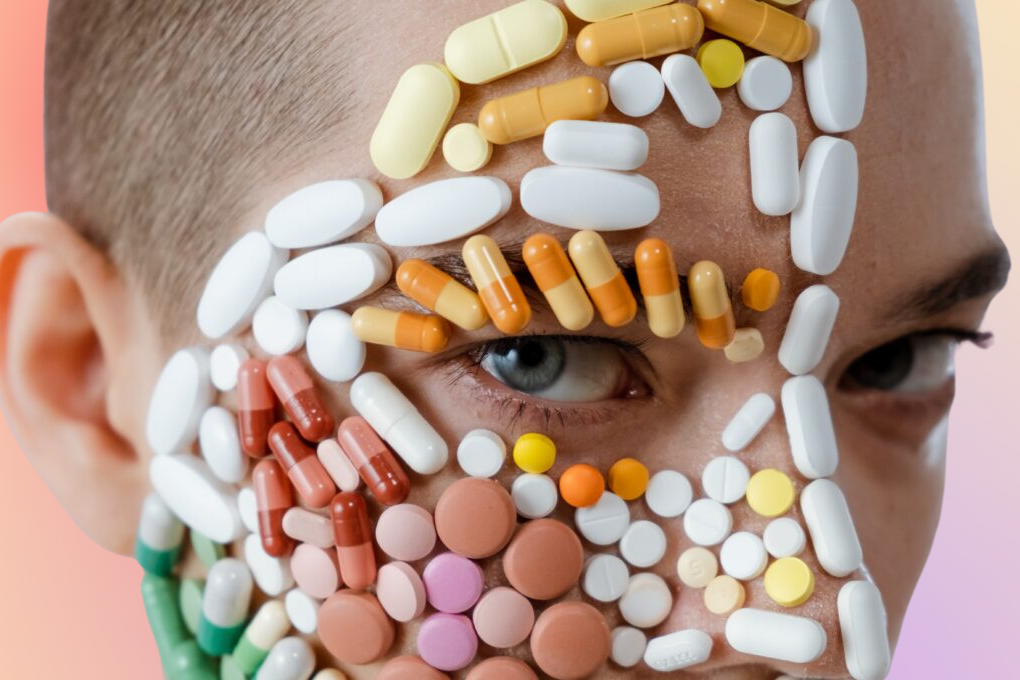 Woman with pills stuck on her face