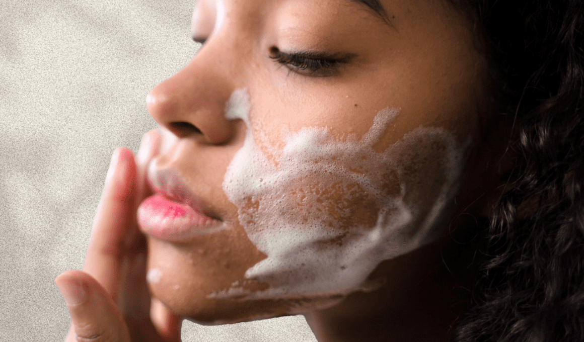 Woman with mild acne washes face with foaming face wash