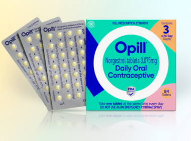 A box of Opill next to three month packs of pills